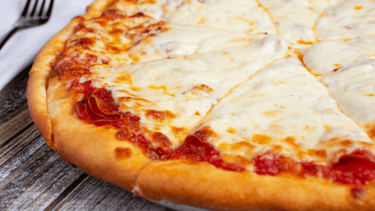 a pizza with cheese and sauce on a plate
