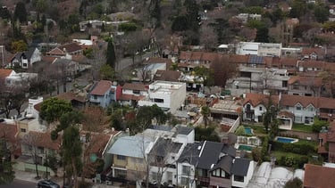 a city street scene with a clock tower in the distance