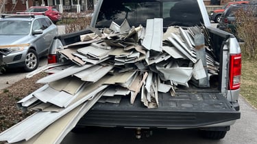 A truck bed filled with aluminum siding to be recycled 
