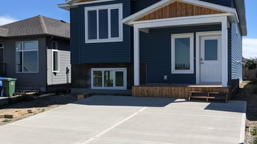 blue siding home with cedar and stone accents