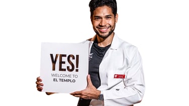 a man in a lab coat holding a sign that says yes