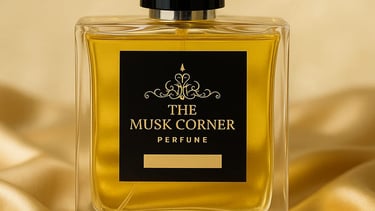 a person's hand holding a bottle of musk corner perfume