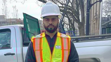 A male security guard from Baig Security actively mobile patrolling the area