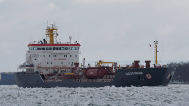 Tanker ship Algocanada navigating through heavy chunks of broken ice. Viewed from the front right side looking aft,