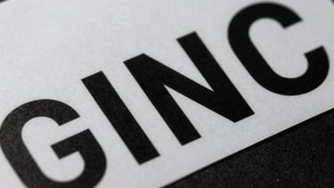 Extreme close-up of crisp typography on physical packaging, high-contrast shadows, technical precision layout.