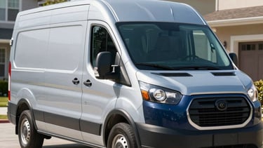 A clean, modern steel blue and dark blue plumbing service van parked in a sunny, professional North American residential driveway. The scene is well-lit, conveying reliability and high-quality service, with a focus on trustworthy professionalism.