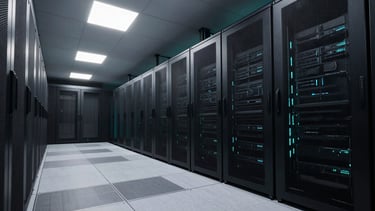 Wide, expansive architectural shot of a modern, low-key lit server room with clean lines and neon-cyan accent lighting, deep obsidian shadows.
