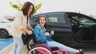 Support worker assisting participant with transport
