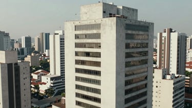 Graphic minimalist representation of motion graphics overlays on an aerial video of a modern building in São Paulo. Professional and clean.