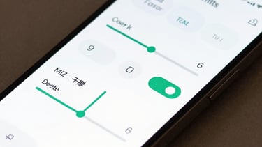 Close-up of a high-resolution smartphone screen showing a sleek interface for a smart home application with intuitive toggles and sliders. Soft studio lighting.