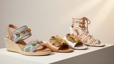 Luxury summer sandals in a cinematic studio setting.