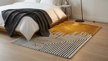 Modern luxury geometric black and white maze hand-tufted rug with liquid gold paint drip effect