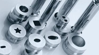 Precision pharmaceutical tablet press tooling and polished stainless steel punch die sets.