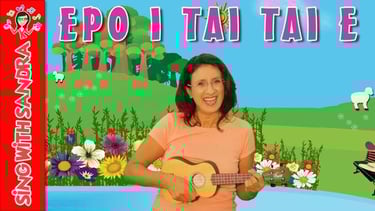 a woman holding a guitar and playing a song
