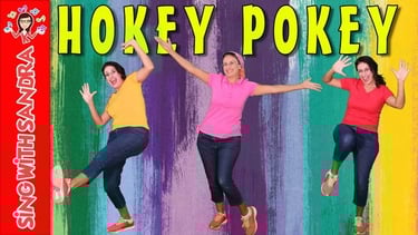 a woman in a pink shirt is jumping in the air