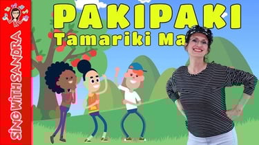 a woman standing in front of a cartoon character kids