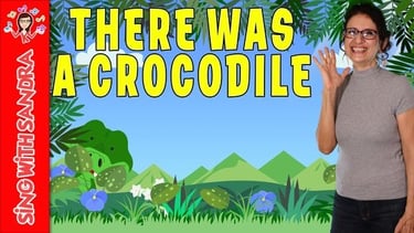 a woman in a gray shirt and glasses with a green background and a cartoon crocodile