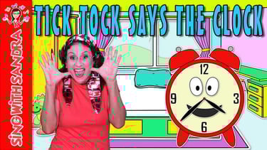 a woman with headphones and a clock on a desk