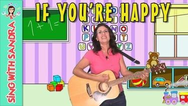 a woman is playing guitar and singing