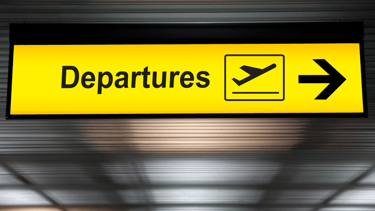 a sign board with a direction sign pointing to the left