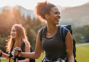 2 women happily hiking with Pibella FUD, 