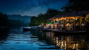people sitting at a table near the river