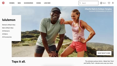 Athletes Charlie Dark and Colleen Quigley relax, smiling, at the top of a hike in LA.