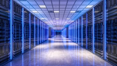 Modern data center aisle with blue server racks, representing cloud engineering infrastructure