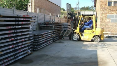 Granite slabs ready to be moved to production by an operator