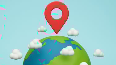 3D-style Earth with clouds and a glowing red location pin hovering above, symbolizing global explora