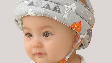 a baby wearing a hat and a hat