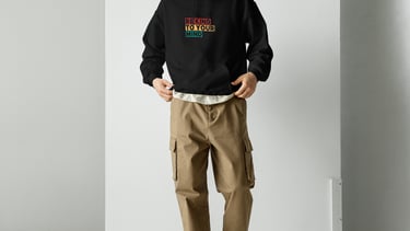 a man in a black hoodie and a hat