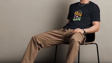 a man sitting on a chair with his feet up