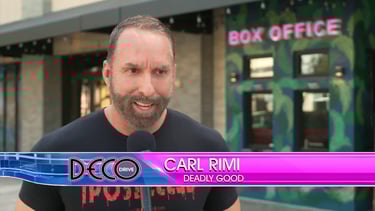 a man in a black shirt and a microphone