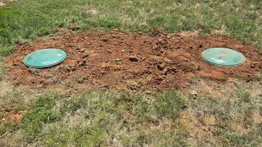 backfilled-dirt-around-new-risers-with-dome-lids-to-TCEQ-standards