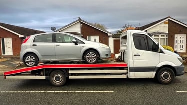a tow truck towing a car