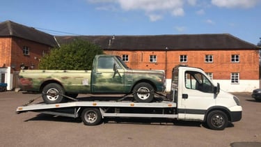 a tow truck delivering a car