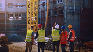 a group of construction workers standing in front of a building
