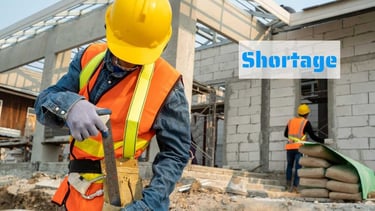 a construction worker in a yellow safety vest and a yellow helmet