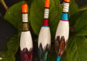 Image of feather inlaid floats.