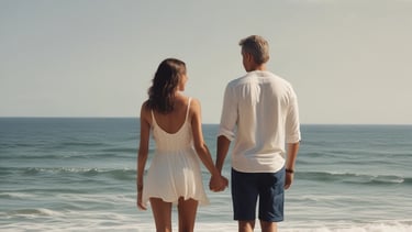 A family of six is gathered together, featuring three children and three adults. They are seated on wicker chairs set against a bamboo backdrop. The adults and children are dressed in coordinated light-colored clothing. The setting appears to be warm and inviting.