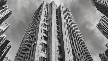 The image features the facade of a modern office building with a clean, geometric design. It is constructed with a combination of red brick and large glass panels, and there is a prominently displayed sign for Tata Consultancy Services in blue. Trees partially frame the view, and a lamppost is visible at the foreground.