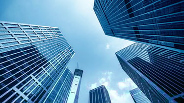 "Modern office buildings interconnected, representing seamless networking solutions for businesses."