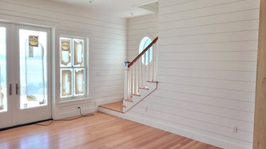 Shiplap paneling with stair system and fir flooring