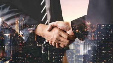 Handshake representing client trust - startup business advice | legal assistance