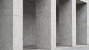 Straight-on architectural photograph of minimalist concrete columns and diffused daylight, sharp focus, neutral gray tones, 35mm