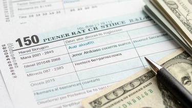 A professional reviewing financial documents in a modern office setting