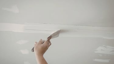 General contractor repairing ceiling.