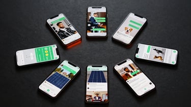 Wide flat-lay overhead shot of seven smartphones arranged in a loose arc on a dark charcoal surface, each screen showing a different WhatsApp conversation context — clinic appointment, barbershop booking, pet shop inquiry, office scheduling, solar panel quote, restaurant reservation, real estate listing — soft studio lighting from above, no human faces, neon-orange ambient glow on the surface between devices