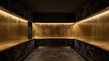 Wide shot of an ultra-private, minimalist medical showroom in Houston's Kirby district, dark velvet textures, brushed gold accents, low-key warm lighting, empty and silent sanctuary.